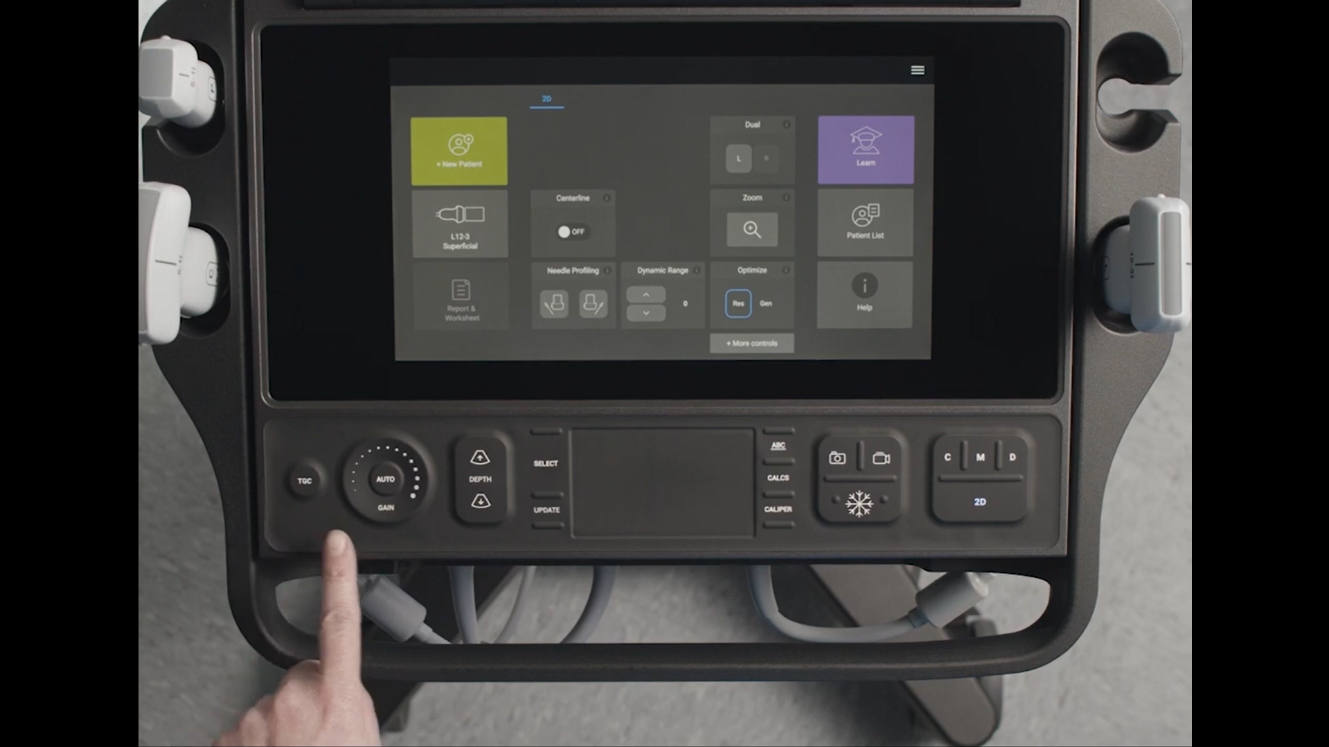 Picture of finger pointing to a button on Sonosite PX
