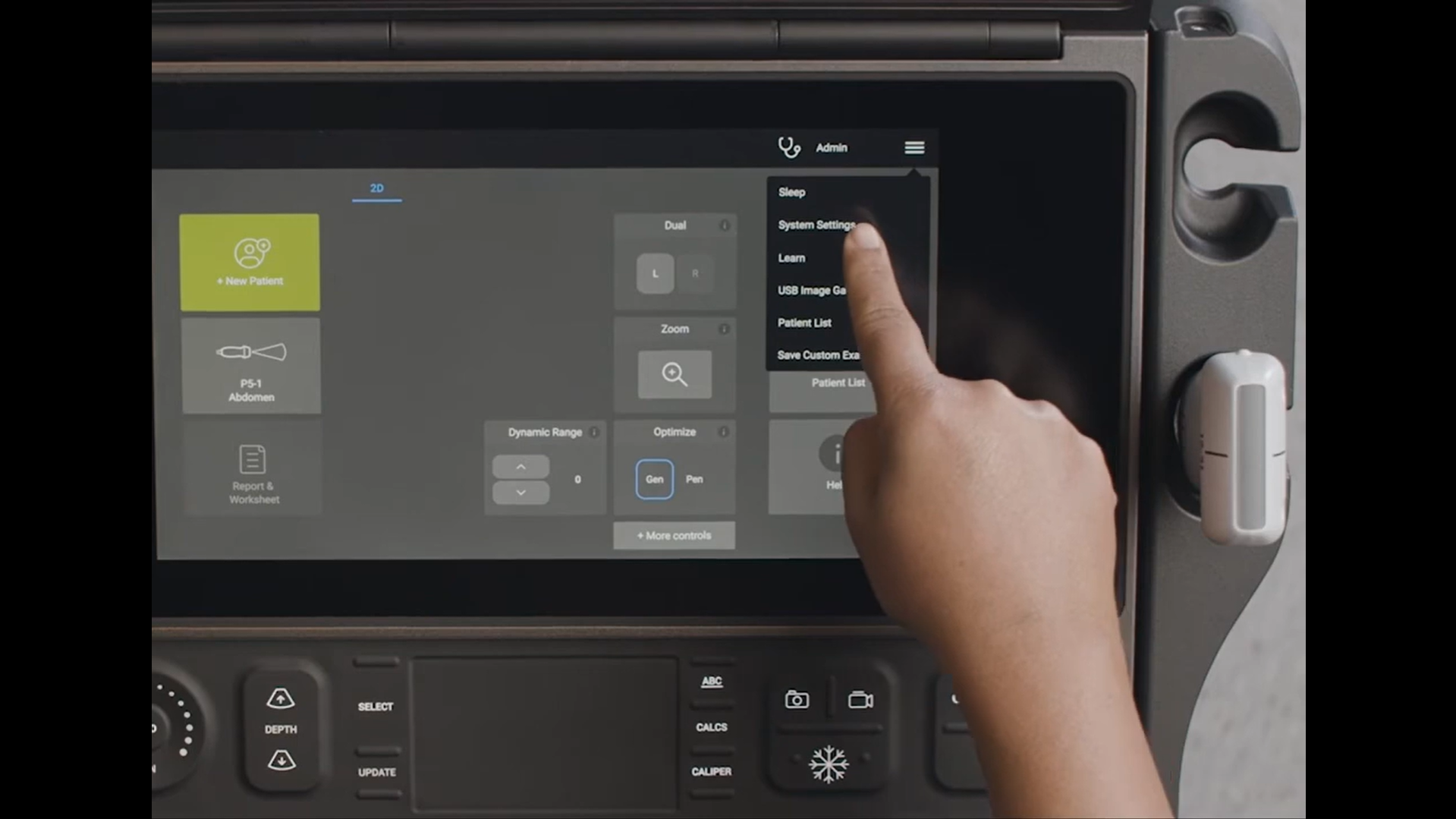 Picture of finger pointing to a button on Sonosite PX
