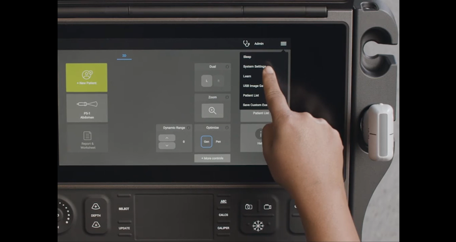 Picture of finger pointing to a button on Sonosite PX